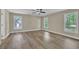 Spacious bedroom with stylish floors, neutral walls, and bright windows at 2000 Mcconnell Rd, Grayson, GA 30017
