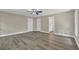 Large bedroom with hardwood floors and a ceiling fan featuring access to the ensuite bathroom at 2000 Mcconnell Rd, Grayson, GA 30017