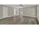 Expansive bedroom showcases wood floors and ensuite bathroom access, plus natural light at 2000 Mcconnell Rd, Grayson, GA 30017