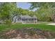Charming single-Gathering home with inviting front porch and lush green lawn surrounded by mature trees at 2000 Mcconnell Rd, Grayson, GA 30017