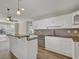 Open concept kitchen with granite countertops, stainless appliances, and breakfast bar with seating at 2000 Mcconnell Rd, Grayson, GA 30017