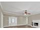 Bright living room with a fireplace, hardwood floors, and a welcoming atmosphere at 2000 Mcconnell Rd, Grayson, GA 30017