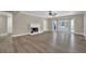 Spacious living room showcasing hardwood floors, a fireplace, and access to the outdoor space at 2000 Mcconnell Rd, Grayson, GA 30017