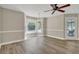 Bright living room with wood floors, lots of natural light, and access to a covered outdoor deck at 2000 Mcconnell Rd, Grayson, GA 30017