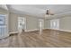 Open-concept living room with hardwood floors and ample natural light creating an inviting space at 2000 Mcconnell Rd, Grayson, GA 30017