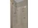 This bathroom features a stand up shower with white tile and multiple shower heads at 2000 Mcconnell Rd, Grayson, GA 30017