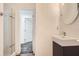Modern bathroom vanity with a sleek rectangular sink and glass-enclosed shower at 2459 Cedar Canyon Se Ct, Marietta, GA 30067
