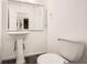 Pedestal sink bathroom with neutral tones at 2459 Cedar Canyon Se Ct, Marietta, GA 30067