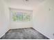 Bedroom featuring plush grey carpeting and a window offering natural light at 2459 Cedar Canyon Se Ct, Marietta, GA 30067