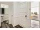 Bright entryway with white trim, a view of the bathroom, and a large front door at 2459 Cedar Canyon Se Ct, Marietta, GA 30067