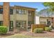 Multi-level brick and siding townhouse with well-maintained front landscaping at 2459 Cedar Canyon Se Ct, Marietta, GA 30067