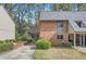 Brick exterior featuring a carport, well-maintained lawn, and mature landscaping at 2459 Cedar Canyon Se Ct, Marietta, GA 30067