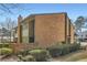 Brick townhouse with lush landscaping, creating a welcoming exterior at 2459 Cedar Canyon Se Ct, Marietta, GA 30067