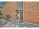 Welcoming brick exterior featuring a covered entryway and landscaped surroundings at 2459 Cedar Canyon Se Ct, Marietta, GA 30067