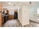 This kitchen has wood cabinets, black appliances and is adjacent to the home's entrance at 2459 Cedar Canyon Se Ct, Marietta, GA 30067