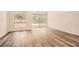 Bright living room featuring hardwood floors and large windows for natural light at 2459 Cedar Canyon Se Ct, Marietta, GA 30067