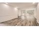 Bright living room with hardwood floors, large windows, and an open layout at 2459 Cedar Canyon Se Ct, Marietta, GA 30067