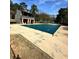 A covered swimming pool with an adjacent deck, offering a relaxing recreation space at 2459 Cedar Canyon Se Ct, Marietta, GA 30067
