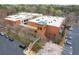 Aerial shot of Liberty Lofts, with brick facade, lush greenery, and ample parking at 1846 Liberty Ln, Roswell, GA 30075