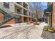 Beautiful brick courtyard with benches, mature trees, and access to units at 1846 Liberty Ln, Roswell, GA 30075