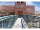 Exterior view of the Liberty Lofts building, with a pedestrian bridge entrance at 1846 Liberty Ln, Roswell, GA 30075