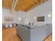 Spacious living room featuring exposed beams, hardwood floors, and modern decor at 1846 Liberty Ln, Roswell, GA 30075