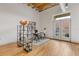Bright home office space with shelving, french doors, and light hardwood flooring at 1846 Liberty Ln, Roswell, GA 30075