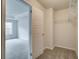 Bedroom closet with open white door featuring wire shelving and neutral walls and carpet at 4544 Eastbrook Pl, Snellville, GA 30039
