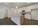 Well-equipped kitchen with granite countertops, modern appliances, and center island, offering a stylish and functional space at 4544 Eastbrook Pl, Snellville, GA 30039