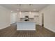 Bright kitchen featuring a large center island with granite counters and ample storage, combining style and functionality at 4544 Eastbrook Pl, Snellville, GA 30039