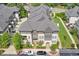 Aerial view of townhomes with manicured landscaping and gray roofs at 6596 Aria Village Dr # 642, Atlanta, GA 30328