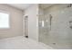 Bathroom with marble tiled shower and glass enclosure at 6596 Aria Village Dr # 642, Atlanta, GA 30328