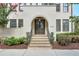 Inviting front entrance featuring a classic archway and landscaped steps leading to the door at 6596 Aria Village Dr # 642, Atlanta, GA 30328