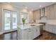 Modern kitchen featuring stainless steel appliances, a large island, and stylish cabinetry with great lighting at 6596 Aria Village Dr # 642, Atlanta, GA 30328