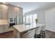 Contemporary kitchen with stainless steel appliances, a large island, and bar stool seating at 6596 Aria Village Dr # 642, Atlanta, GA 30328