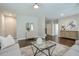 Spacious living room with hardwood floors, neutral paint, and an open layout at 6596 Aria Village Dr # 642, Atlanta, GA 30328