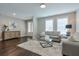 Comfortable living room with hardwood floors, neutral walls, and a stylish rug at 6596 Aria Village Dr # 642, Atlanta, GA 30328