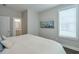 Calm main bedroom featuring neutral paint, hardwood floors, and a view to the bath at 6596 Aria Village Dr # 642, Atlanta, GA 30328
