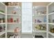 Organized pantry with shelving providing ample storage space for all your kitchen essentials at 6596 Aria Village Dr # 642, Atlanta, GA 30328