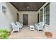 Cozy patio with brick flooring and white wicker furniture, perfect for outdoor relaxation at 6596 Aria Village Dr # 642, Atlanta, GA 30328