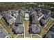 Aerial view of neighborhood properties, community pool, and manicured central green space at 6739 Encore Blvd, Atlanta, GA 30328