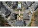 Bird's-eye view of an upscale community featuring townhomes, landscaping, walking paths, and a central community building at 6739 Encore Blvd, Atlanta, GA 30328