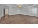 Spacious bedroom with hardwood flooring, stylish lighting, and large window at 6739 Encore Blvd, Atlanta, GA 30328