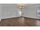 Spacious bedroom with hardwood flooring, stylish lighting, and large window at 6739 Encore Blvd, Atlanta, GA 30328
