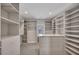 Spacious walk-in closet with custom built-in shelving and drawers for ample storage at 6739 Encore Blvd, Atlanta, GA 30328