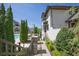 Exterior view of a home with pool access and walking path, nicely landscaped at 6739 Encore Blvd, Atlanta, GA 30328