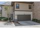 Two-car garage with an attached side entryway and landscaped yard at 6739 Encore Blvd, Atlanta, GA 30328