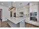 Well-equipped kitchen featuring an island, stainless steel appliances, and ample storage at 6739 Encore Blvd, Atlanta, GA 30328