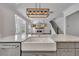 Bright, open-concept kitchen with a large island, farmhouse sink, and modern lighting at 6739 Encore Blvd, Atlanta, GA 30328