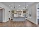 Open kitchen with an island, stainless steel appliances, and designer lighting at 6739 Encore Blvd, Atlanta, GA 30328